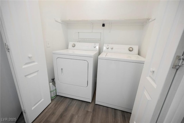 laundry room with laundry area, dark wood-style flooring, and washing machine and dryer