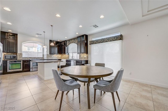 dining room with recessed lighting, visible vents, and light tile patterned floors