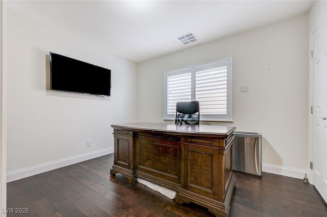 office featuring baseboards, visible vents, and dark wood-style floors