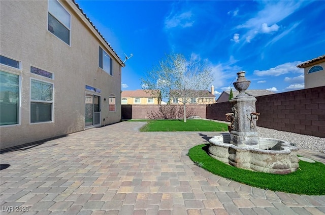 exterior space with a patio area and fence