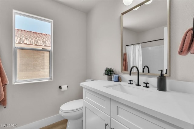 bathroom with vanity, wood finished floors, toilet, baseboards, and a shower with curtain