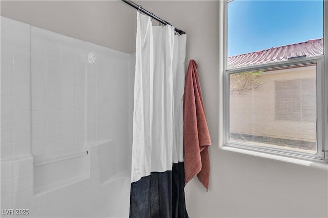 bathroom featuring a shower with curtain