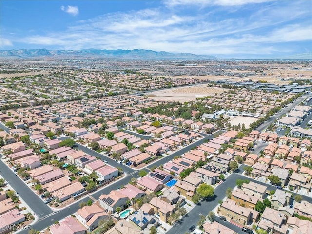 birds eye view of property with a residential view and a mountain view