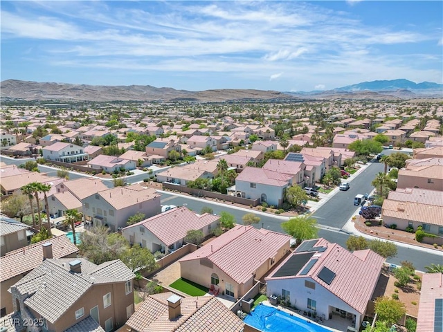 birds eye view of property with a residential view and a mountain view