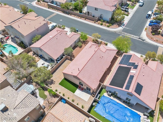 birds eye view of property with a residential view