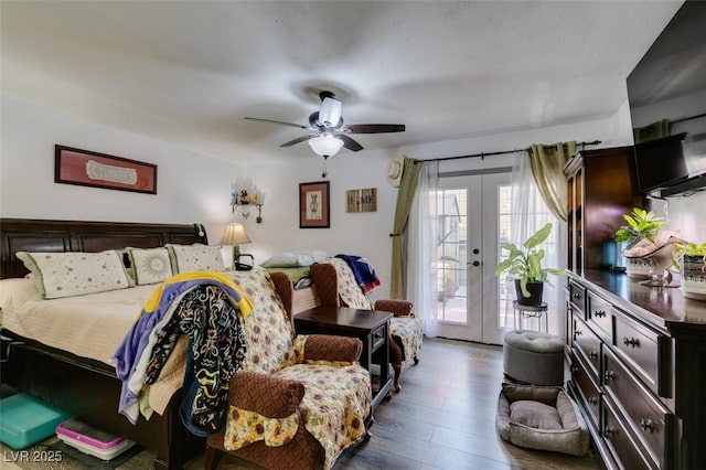 bedroom featuring french doors, a ceiling fan, dark wood finished floors, and access to exterior