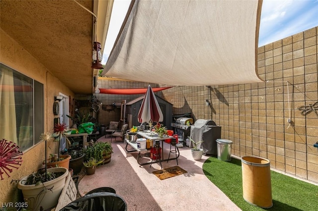 view of patio / terrace with fence