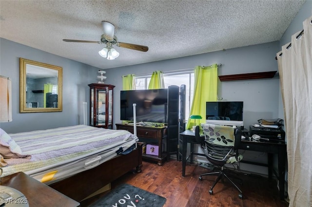 bedroom featuring a ceiling fan, a textured ceiling, and wood finished floors