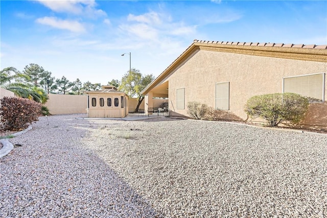 view of home's exterior featuring a fenced backyard, stucco siding, and a patio area