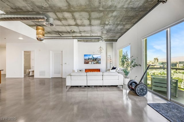 living area with concrete flooring