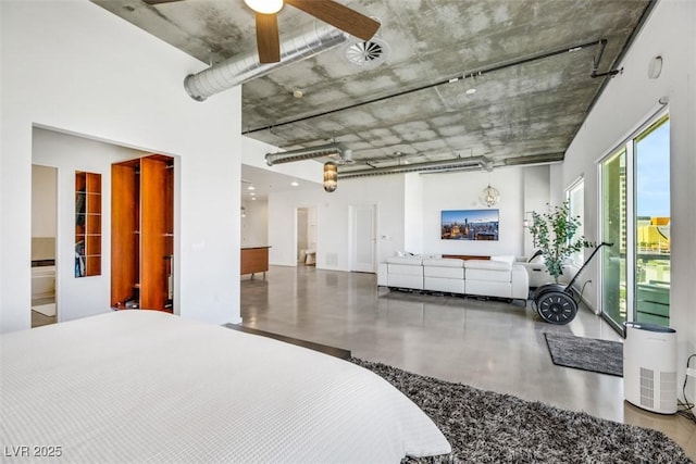 bedroom with a ceiling fan and concrete flooring