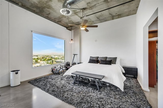 bedroom featuring baseboards and ceiling fan