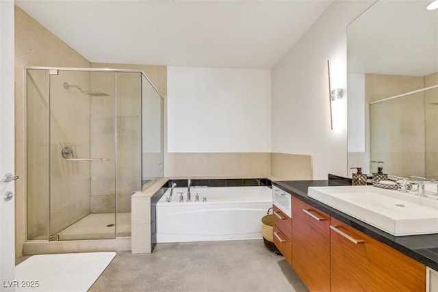bathroom with vanity, a garden tub, a shower stall, and finished concrete floors