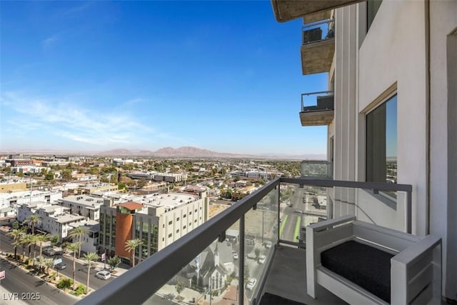 balcony featuring a view of city and a mountain view