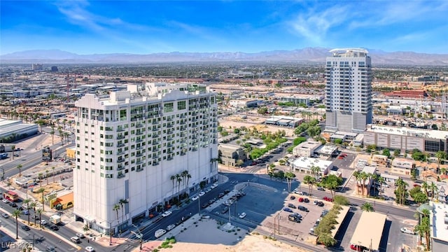 birds eye view of property with a city view and a mountain view