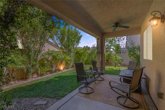 view of patio featuring ceiling fan and a fenced backyard