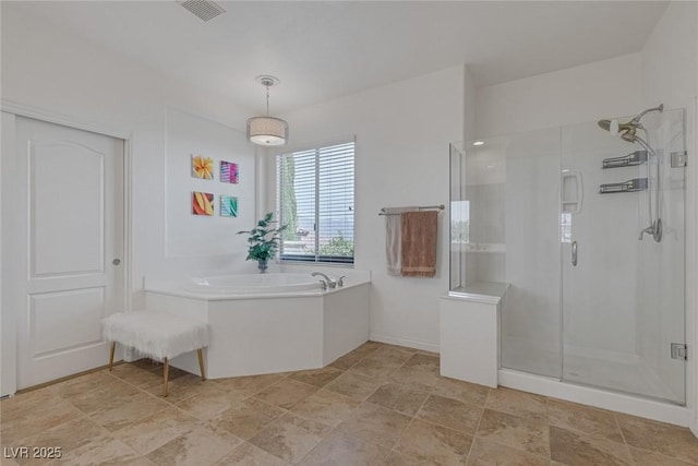 full bath featuring stone finish floor, a stall shower, a bath, and visible vents