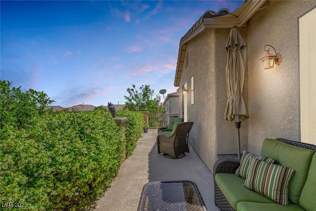 view of side of home with stucco siding