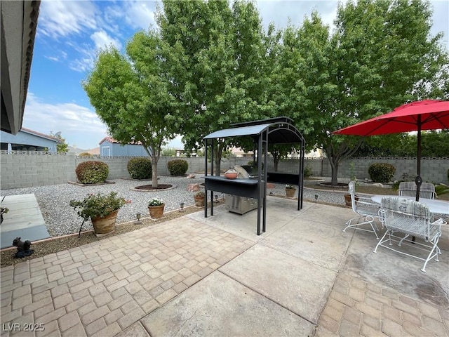 5200 Wheatland Dr, Pahrump, NV 89061 - view of patio featuring a fenced backyard and outdoor dining area