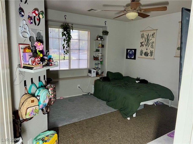 carpeted bedroom featuring visible vents, a ceiling fan, and baseboards