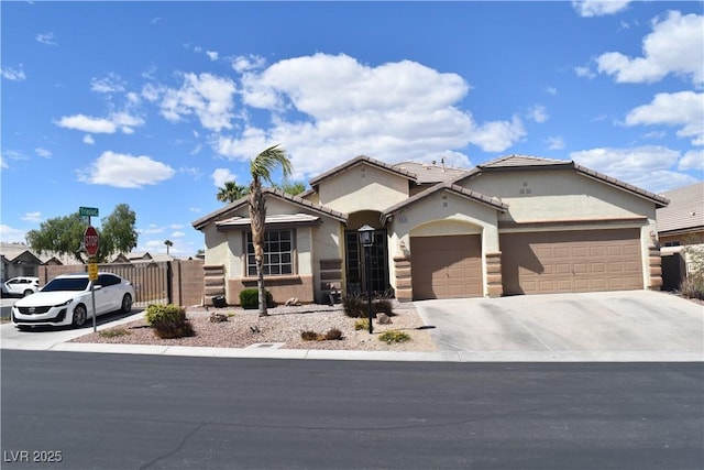 ranch-style home featuring fence, an attached garage, stucco siding, a gate, and concrete driveway
