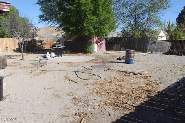 view of yard featuring a fenced backyard and a patio area