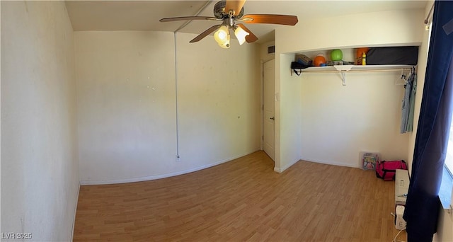 unfurnished bedroom with light wood finished floors, a ceiling fan, baseboards, visible vents, and a closet