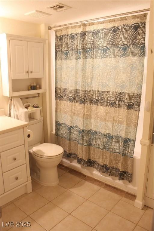 full bathroom with shower / bath combo with shower curtain, toilet, visible vents, and tile patterned flooring