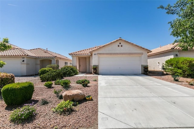 8877 Perfect Diamond Ct, Las Vegas, NV 89129 - view of front of house featuring an attached garage, stucco siding, a tiled roof, and concrete driveway