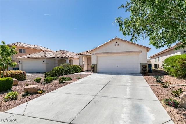 8877 Perfect Diamond Ct, Las Vegas, NV 89129 - view of front facade featuring stucco siding, a tiled roof, driveway, and a garage