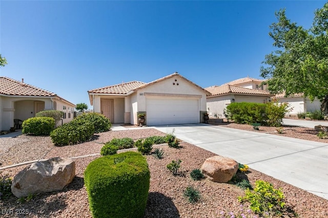 8877 Perfect Diamond Ct, Las Vegas, NV 89129 - mediterranean / spanish house with a tiled roof, an attached garage, driveway, and stucco siding