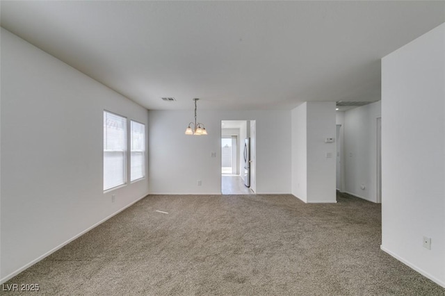 8877 Perfect Diamond Ct, Las Vegas, NV 89129 - carpeted spare room featuring an inviting chandelier, baseboards, and visible vents