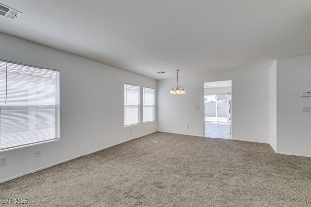 8877 Perfect Diamond Ct, Las Vegas, NV 89129 - carpeted empty room featuring baseboards, a notable chandelier, and visible vents