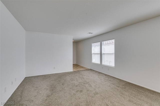 8877 Perfect Diamond Ct, Las Vegas, NV 89129 - empty room with baseboards, light carpet, and visible vents