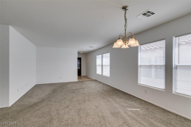 8877 Perfect Diamond Ct, Las Vegas, NV 89129 - carpeted empty room featuring visible vents, baseboards, and a notable chandelier