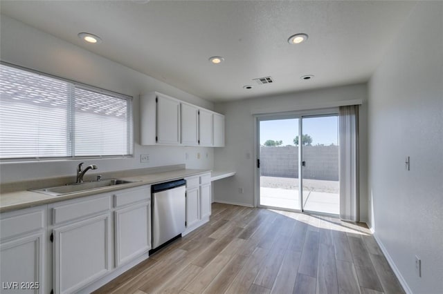8877 Perfect Diamond Ct, Las Vegas, NV 89129 - kitchen featuring a sink, visible vents, white cabinetry, and dishwasher