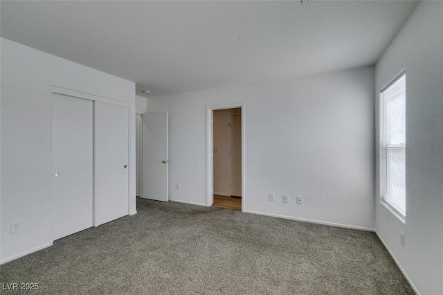 8877 Perfect Diamond Ct, Las Vegas, NV 89129 - unfurnished bedroom with carpet floors, multiple windows, baseboards, and a closet