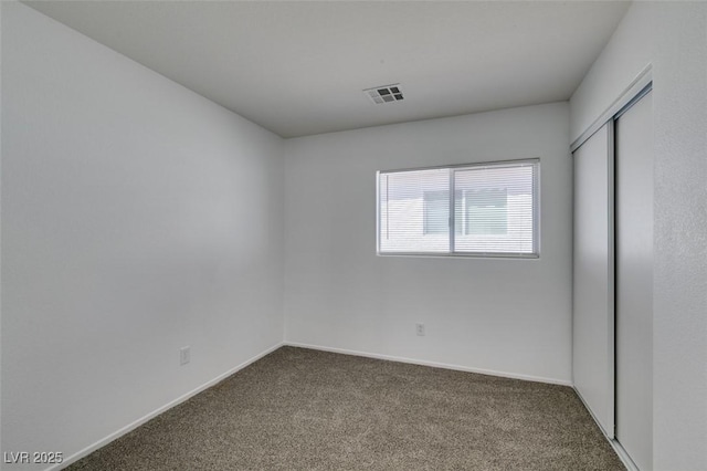 8877 Perfect Diamond Ct, Las Vegas, NV 89129 - unfurnished bedroom with carpet floors, baseboards, a closet, and visible vents