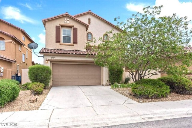 mediterranean / spanish home with a garage, driveway, a tile roof, and stucco siding