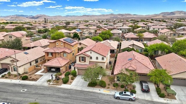 birds eye view of property with a residential view and a mountain view