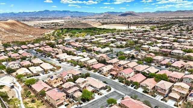 birds eye view of property with a residential view and a mountain view