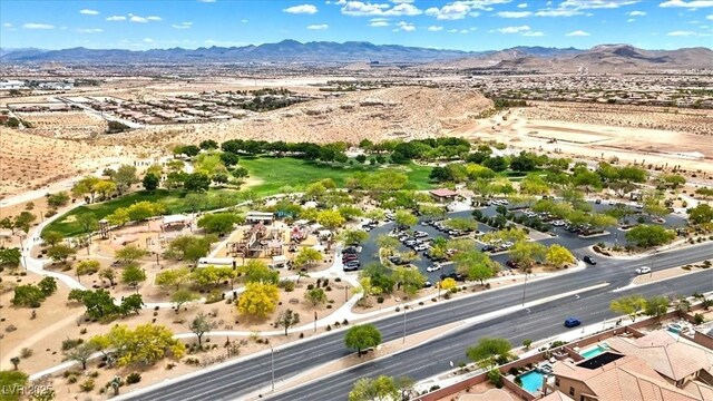 bird's eye view featuring a mountain view and view of desert