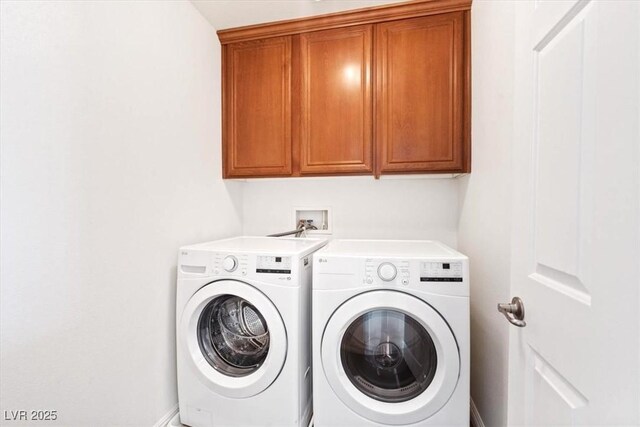 laundry room with cabinet space and washing machine and dryer