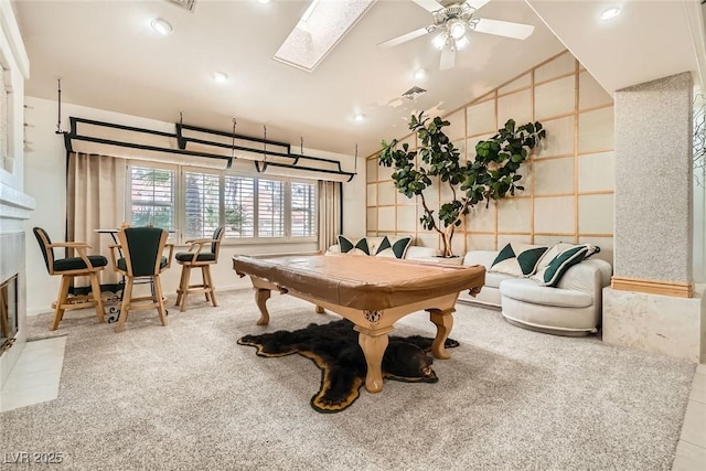 game room featuring vaulted ceiling with skylight, pool table, a ceiling fan, and visible vents