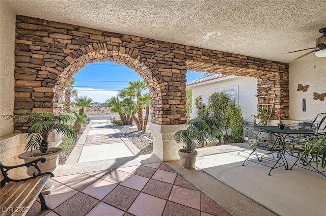 view of patio / terrace featuring outdoor dining space and ceiling fan