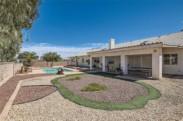 view of yard featuring a fenced backyard, a fenced in pool, and a patio