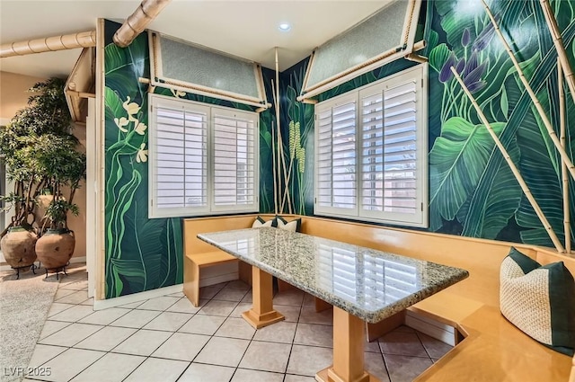dining space with tile patterned floors