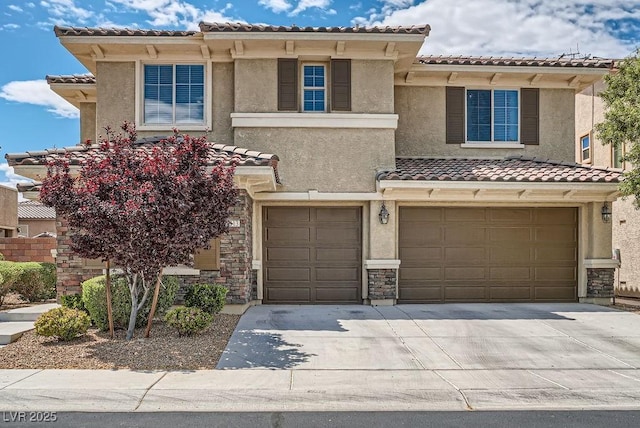 view of front of house featuring concrete driveway, an attached garage, stucco siding, and a tile roof