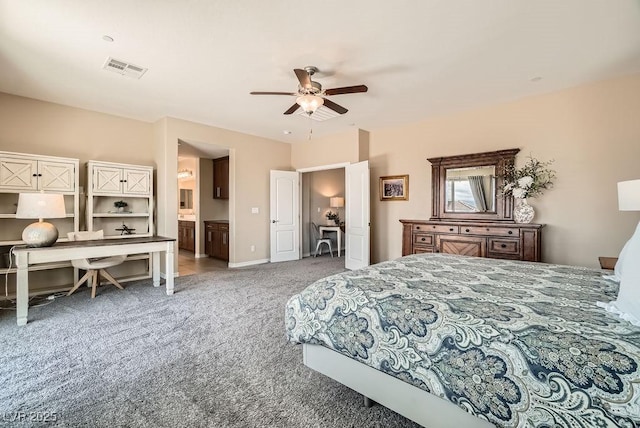 bedroom featuring ceiling fan, ensuite bathroom, carpet flooring, and visible vents