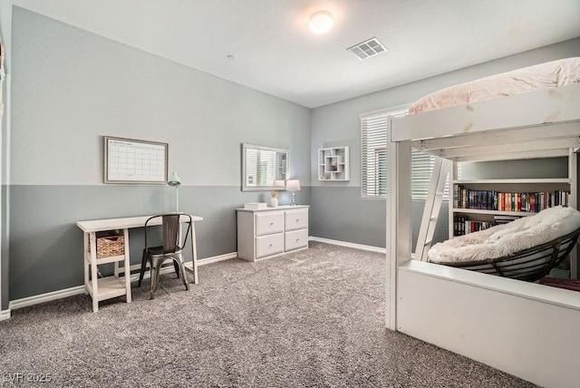 carpeted bedroom featuring baseboards and visible vents